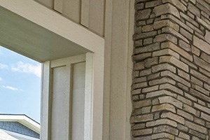 Covered Lounge with Cozy Fireplace by Pool at El Paso County Apartments Near I-25